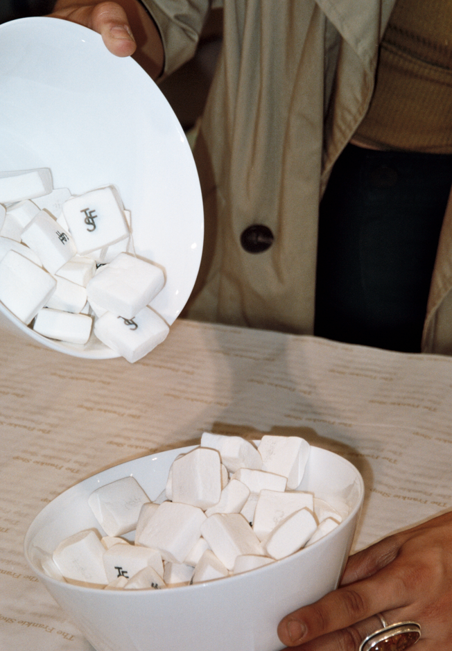 A close up of white marshmellows with The Frankie Shop logo on them.