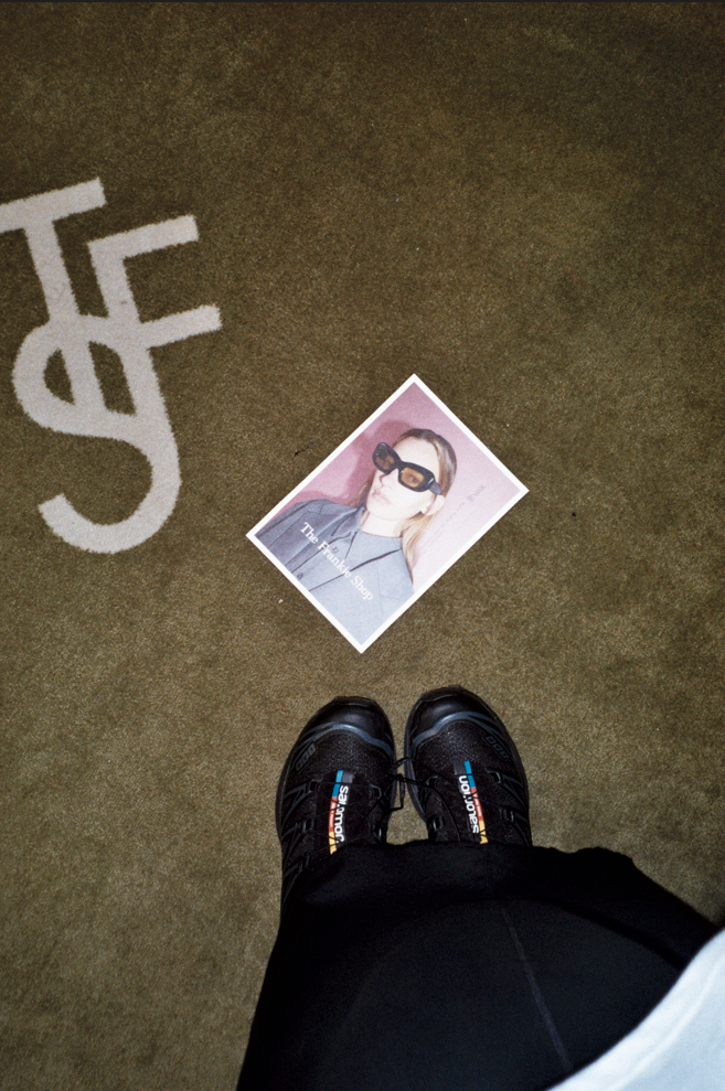 Image of the Frankie Shop advertisement card on the floor at Galeries Lafayette.