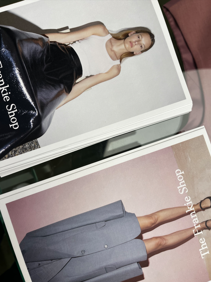 A close up of The Frankie Shop cards at the opening of The Frankie Shop Galeries Lafayette.
