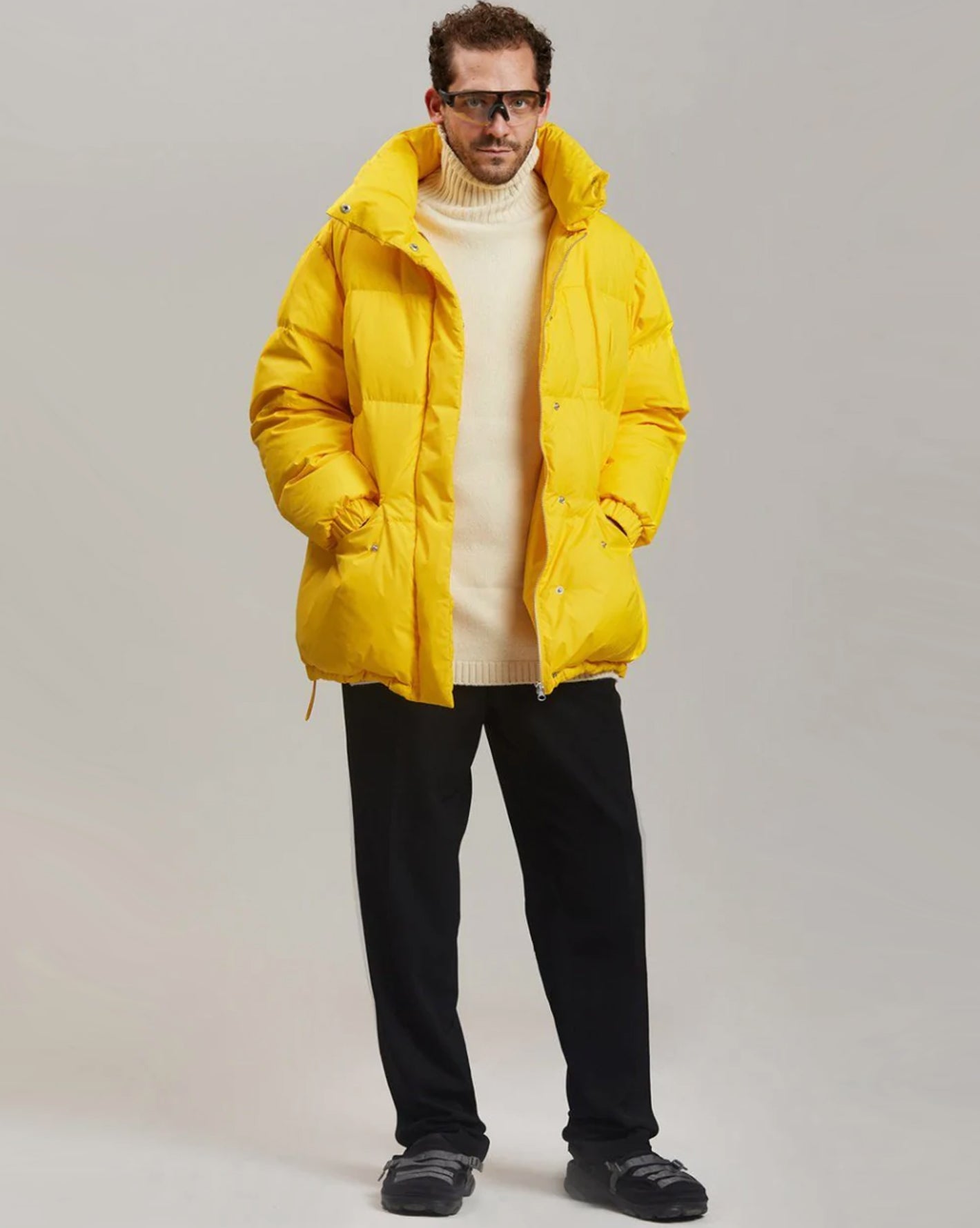 Male model wearing the yellow Val puffer jacket.