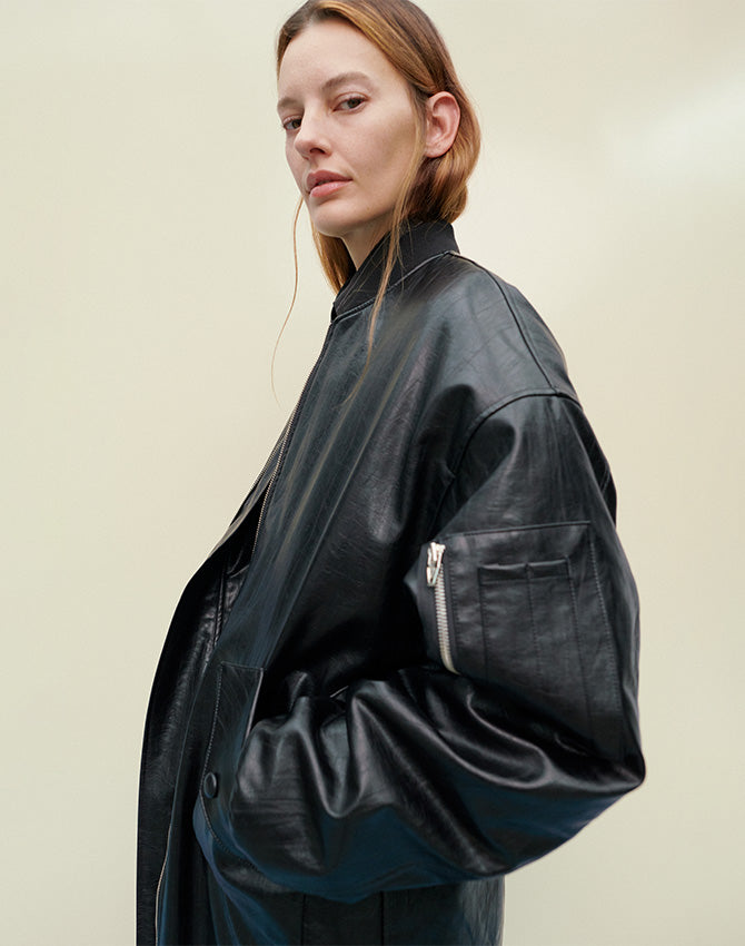 Amanda Murphy captured by Chris Rhodes wearing The Frankie Shop Jesse long faux leather bomber. 