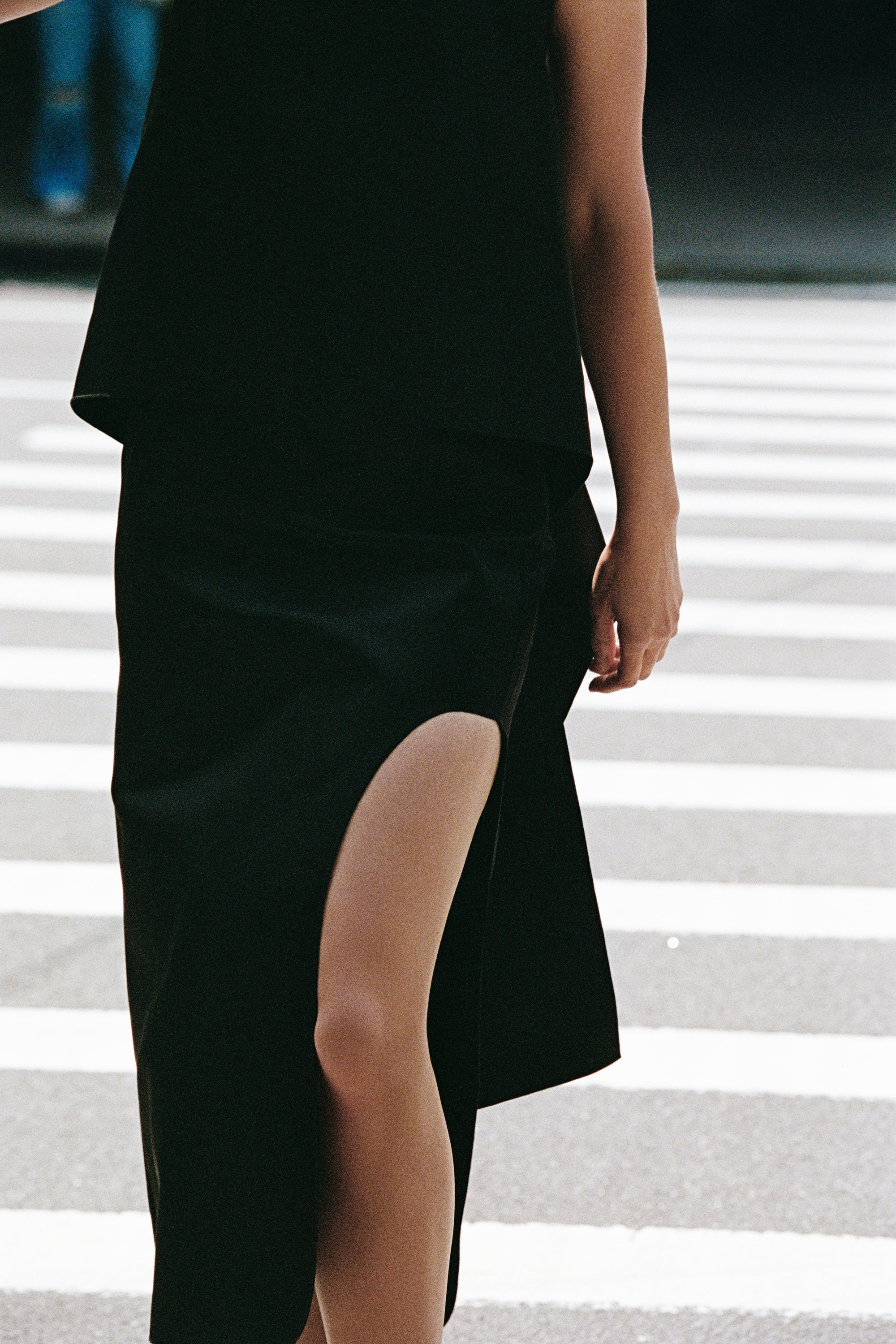 Model walking through the street wearing By Malene Birger 