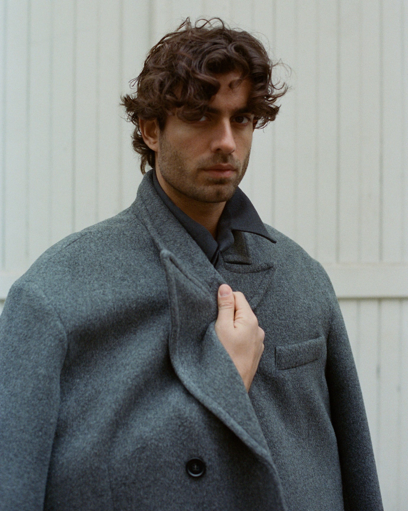 Male model in the Frankie Shop curtis coat in charcoal. 