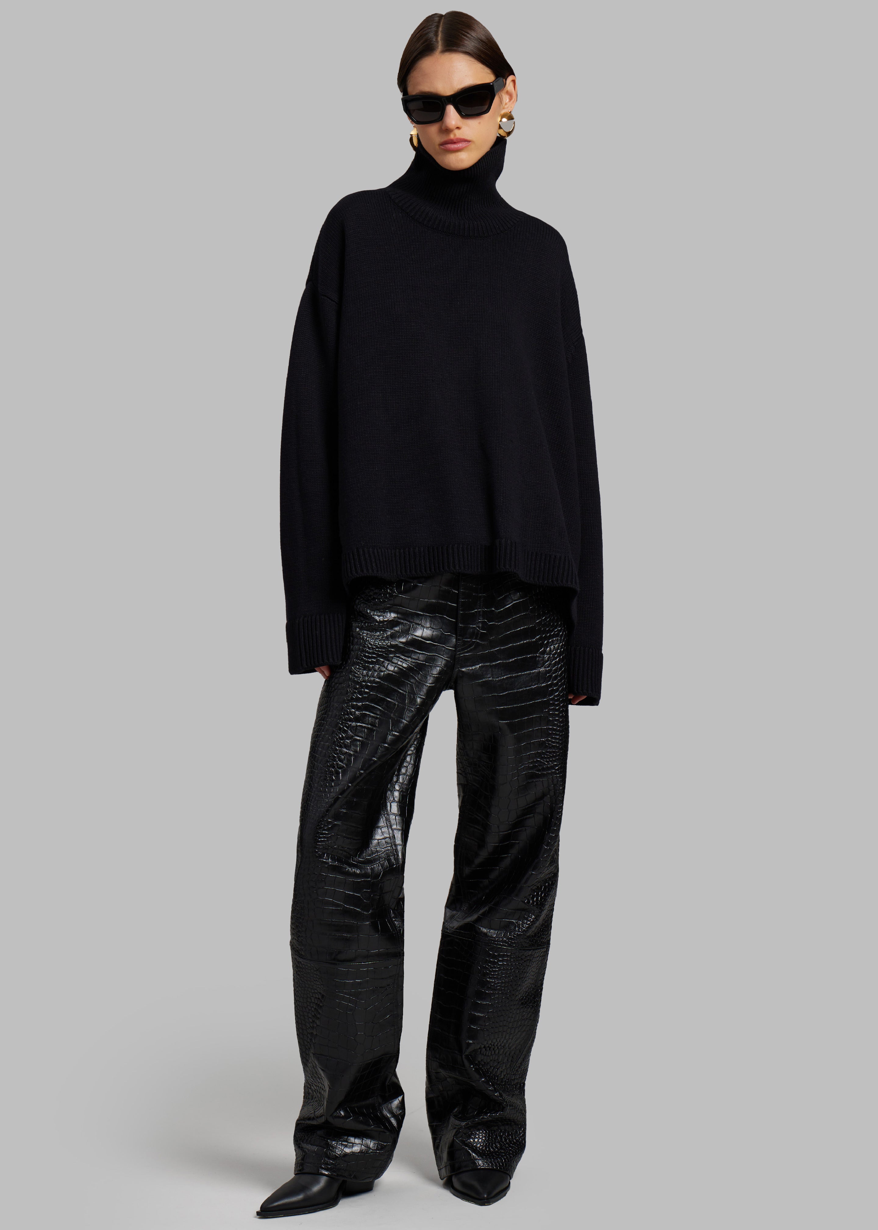 Black turtleneck in store sale