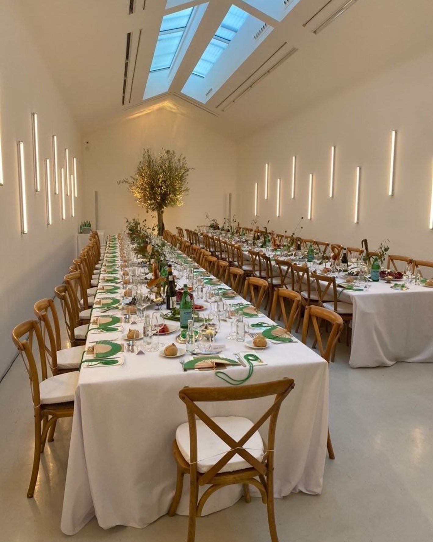 Tables decorated and set in a gallery space for The Frankie Shop event. 