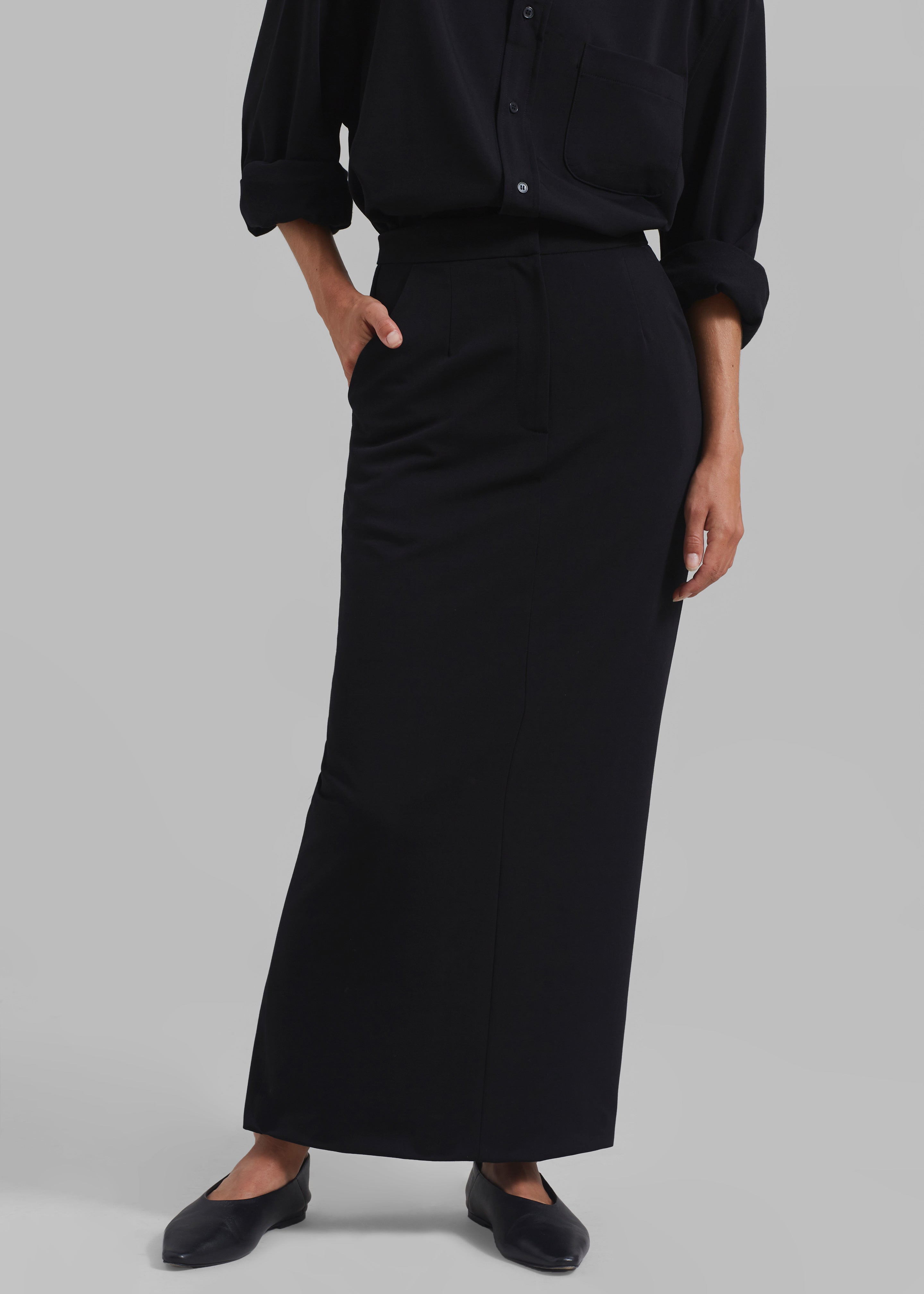 Long black skirt with 2 outlet slits